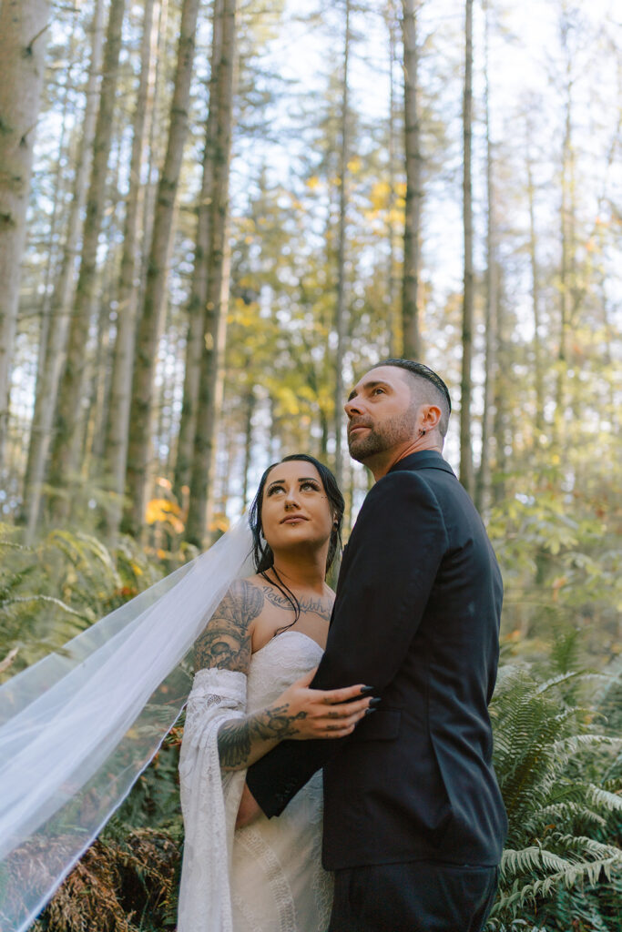couple getting married in the forest during the fall season