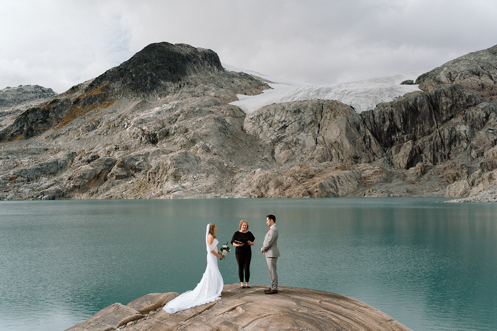 couple having a wedding ceremony at a mountain top in Whistler