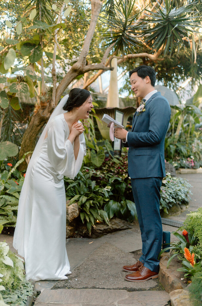 couple reading their vows at Bloedel Conservatory in Vancouver
