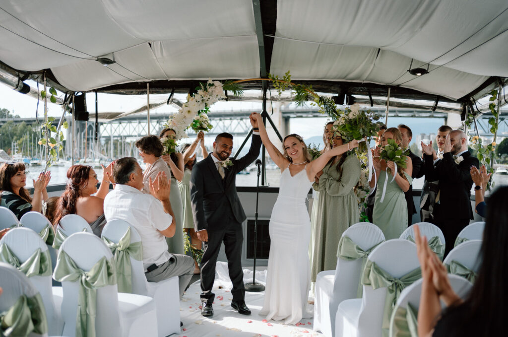 recently married couple celebrating in a luxury yacht in Vancouver Grandville Island