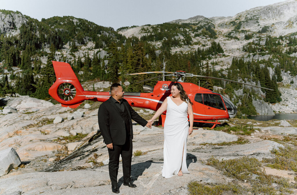 couple getting out of blackcomb helicopters for their Whistler elopement