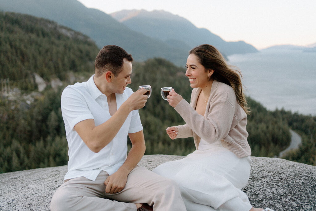photographer captures couple drinking coffee in a mountain top in British Columbia