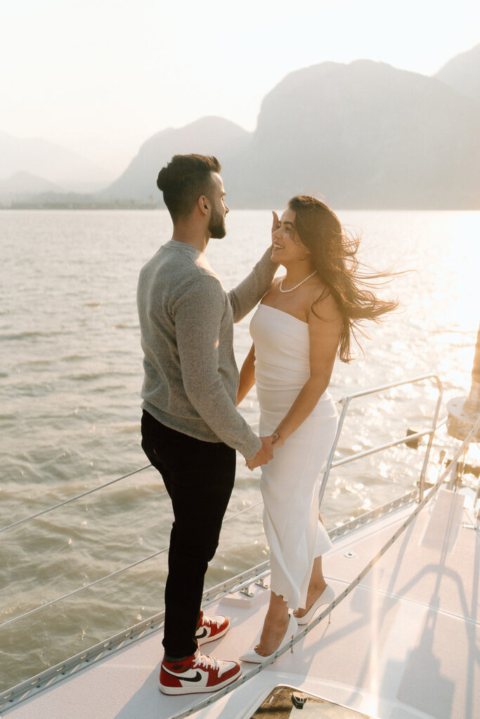 photographer captures engaged couple at a sailboat near Vancouver