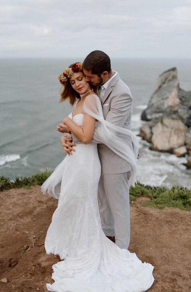 couple hugging during elopement ceremony in the coast of Portugal