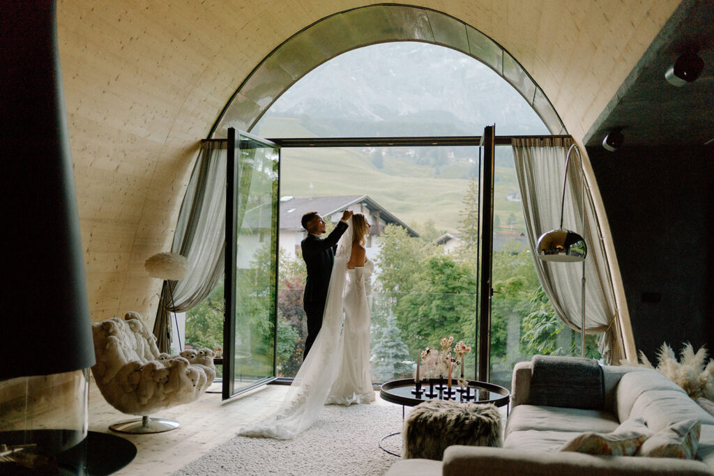 Couple getting ready for wedding in mi chalet in Alta Badia, The Dolomites