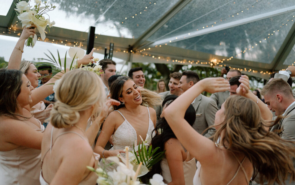 Wedding party dancing in tropical Tulum wedding